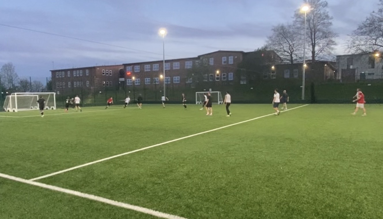 Players on the 3G pitch under floodlights at a Monday Night Football session.
